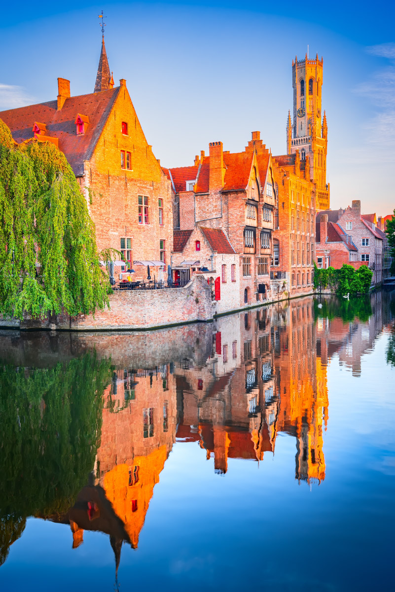 Bruges, Belgium. Rozenhoedkaai Canal in downtown of Brugge, sunrise colors. Famous Flanders destination.